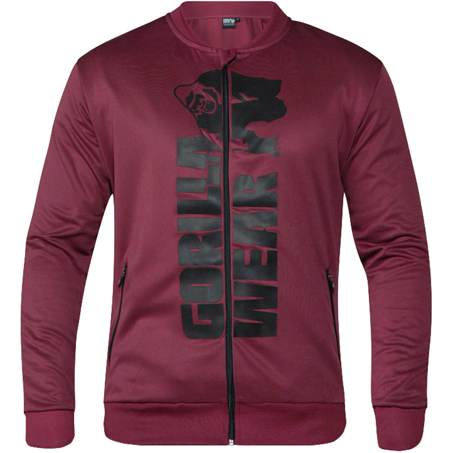 Gorilla Wear Ballinger Track Jacket on laadukas takki niin harjoitteluun kuin vapaa-aikaan, kuvattu edestä. Musta logo vetoketjun ympärillä